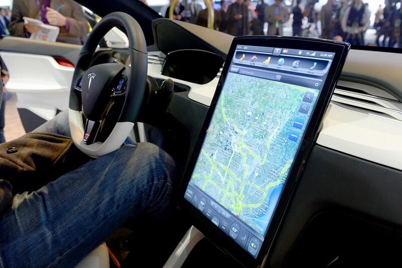 The Tesla Model X computer screen mounted on the dashboard is introduced at the Detroit Auto Show last year. Stan Honda/ AFP