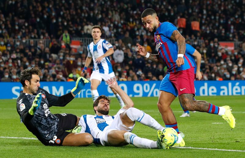 Barcelona's Memphis Depay (standing) wins the penalty, from where he will score the game's only goal . Reuters