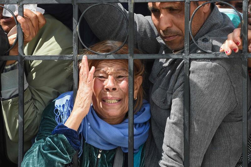 Impoverished Tunisian citizens gather in front of the headquarters of Mnihla delegation in Ariana Governorate. AFP