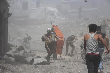 Syrian regime air strikes hit Jisr Al Shughur, in the south-west of Idlib, on July 11, 2019. Syrian Civil Defence White Helmets via AP