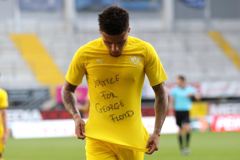 File photo dated 31-05-2020 of Jadon Sancho of Borussia Dortmund celebrates scoring his teams second goal of the game with a 'Justice for George Floyd' shirt. PA Photo. Issue date: Wednesday May 3, 2020. Jadon Sancho will face no further action over his anti-racism gesture during Borussia Dortmund’s win over Paderborn at the weekend. See PA story SPORT Racism Photo credit should read Lars Baron/PA Wire.