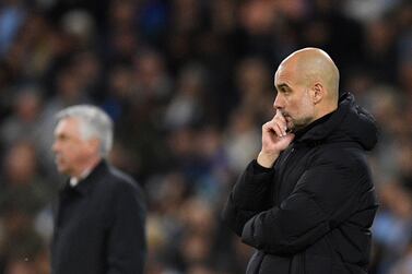 Manchester City's Spanish manager Pep Guardiola reacts during the UEFA Champions League semi-final first leg football match between Manchester City and Real Madrid, at the Etihad Stadium, in Manchester, on April 26, 2022.  (Photo by Oli SCARFF  /  AFP)