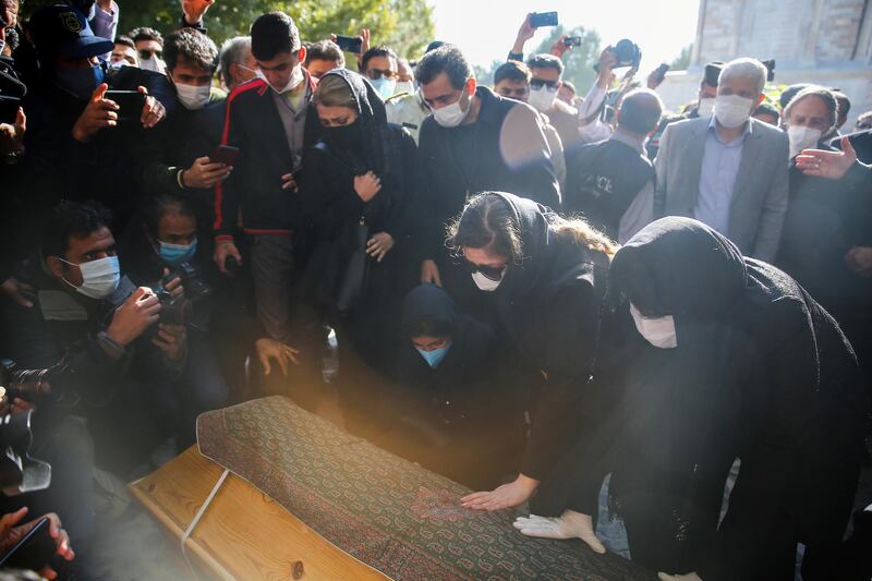 Fans and family members perform funeral prayers. Reuters
