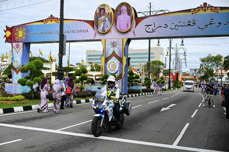 Portraits of groom Prince Abdul Mateen and bride Yanh Mulia Anisha Rosnah have been put up in Brunei's capital Bandar Seri Begawan. AFP 