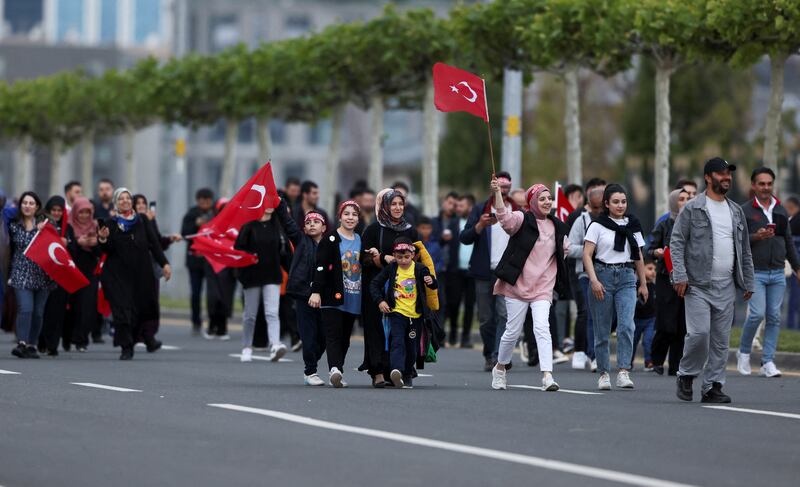 AKP supporters walk to the Presidential Palace in Ankara to attend his victory speech. Reuters