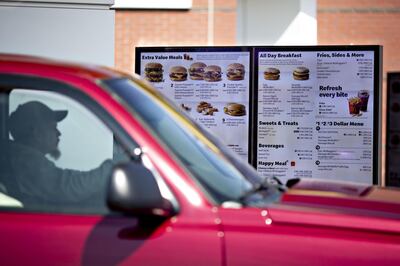 A customer views a digital menu at the drive-thru outside a McDonald's Corp. restaurant in Peru, Illinois, U.S., on Wednesday, March 27, 2019. McDonald's, in its largest acquisition in 20 years, is buying a decision-logic technology company to better personalize menus in its digital push. Photographer: Daniel Acker/Bloomberg