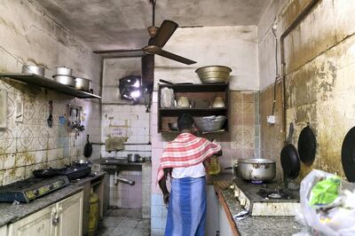 SHARJAH, UNITED ARAB EMIRATES - NOVEMBER 14, 2018. 

A man cooks in his shared home kitchen. His home is two blocks away from where a fire broke out on Monday night in Maysaloon neighborhood.

A woman and her son died in the house fire in Sharjah that injured 64 others, including her elderly parents.

The Pakistani woman, 43, and her seven-year-old son died after suffering from severe burns and smoke inhalation when the fire tore through the property in the crowded Maysaloon area of the emirate at almost 10pm on Monday.

The woman’s parents, in their late 60s, managed to escape the house and shouted for help. They were rescued by firefighters and taken to Sheikh Khalifa Hospital, according to Safeer, their 28-year-old Indian neighbour.

(Photo by Reem Mohammed/The National)

Reporter:  Salam
Section:  na