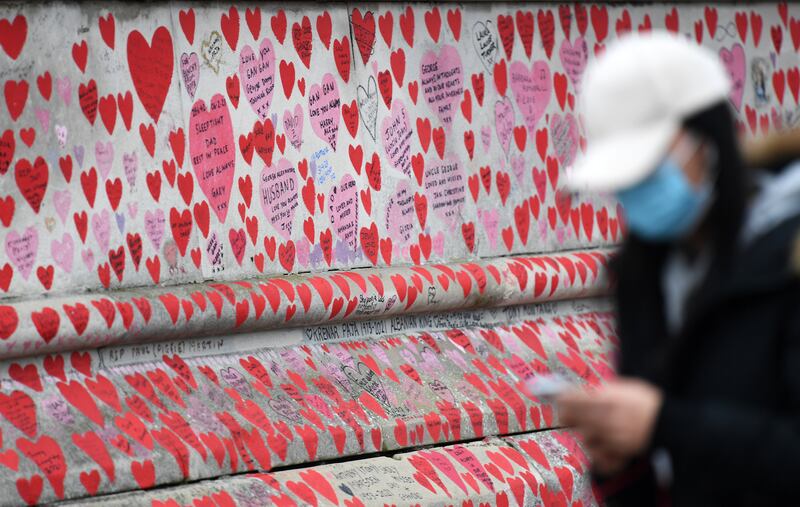 The Covid-19 Memorial Wall in London. The legal requirement to self-isolate after a positive Covid-19 test in England will be scrapped, UK Prime Minister Boris Johnson has announced. EPA