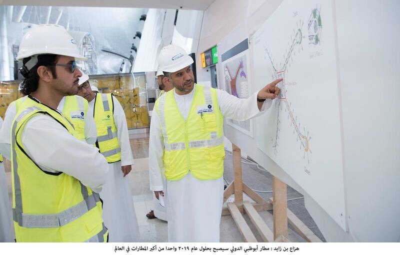 Sheikh Hazza bin Zayed, Deputy Chairman of the Abu Dhabi Executive Council, is shown plans for the Midfield Terminal Building during his visit at Abu Dhabi International Airport on Sunday. Wam