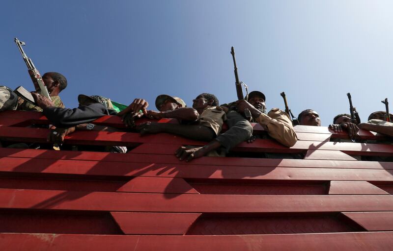 Members of Amhara region militias ride on their truck as they head to the mission to face the Tigray People's Liberation Front (TPLF), in Sanja, Amhara region near a border with Tigray, Ethiopia November 9, 2020. REUTERS/Tiksa Negeri