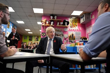 Prime Minister Boris Johnson gestures as he talks with school teachers during a general election campaign visit in Nottinghamshire. (Photo by Daniel Leal-Olivas - WPA Pool/Getty Images)