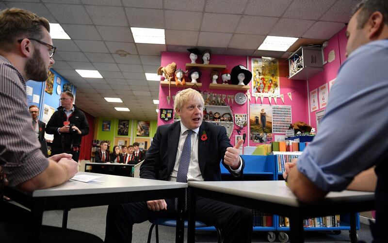 STAPLEFORD, ENGLAND - NOVEMBER 08: Prime Minister Boris Johnson gestures as he talks with school teachers during a general election campaign visit to George Spencer Academy on November 8, 2019 in Stapleford, near Nottinghamshire, United Kingdom. (Photo by Daniel Leal-Olivas - WPA Pool/Getty Images)