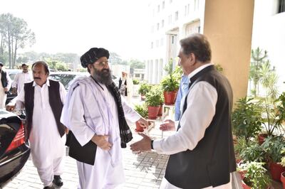epa07891000 A handout photo made available by the Ministry of Foreign Affairs of Pakistan shows Pakistan's Foreign Minister Shah Mehmood Qureshi (R) greeting Taliban movement co-founder and political leader Mullah Abdul Ghani Baradar (2-R) during their meeting in Islamabad, Pakistan, 03 October 2019. The Afghan Taliban delegation, led by Mullah Abdul Ghani Baradar, is in Islamabad for a meeting with Pakistanâ€™s foreign minister in a bid to revive stalled peace talks with the United States.  EPA/MINISTRY OF FOREIGN AFFAIRS OF PAKISTAN / HANDOUT HANDOUT  HANDOUT EDITORIAL USE ONLY/NO SALES