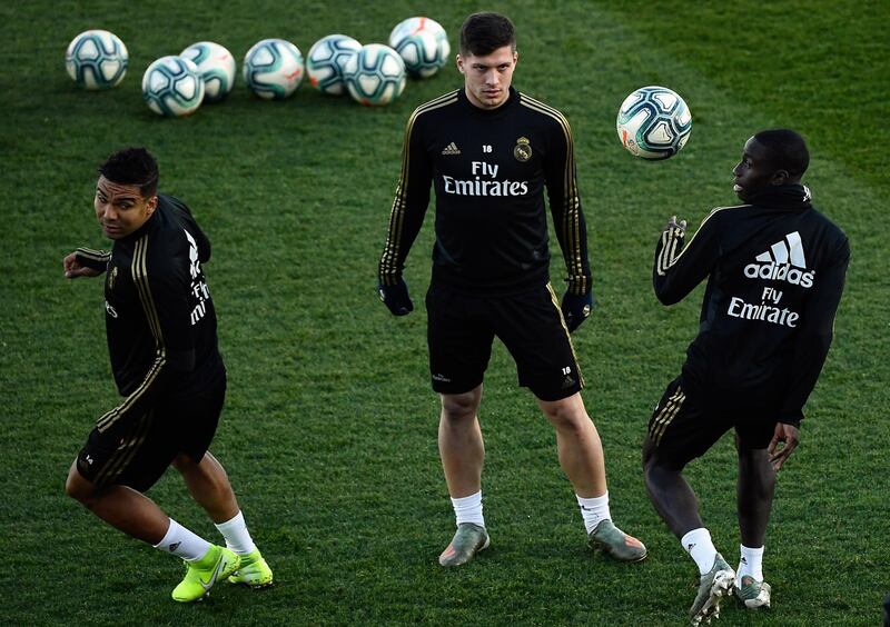 Luka Jovic, centre, with teammates. AFP