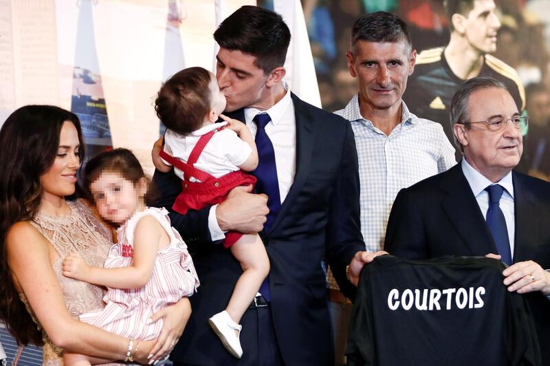 epa06937728 Real Madrid's president, Florentino Fernandez (R), poses next to Belgian Thibaut Courtois (3R), his wife, Marta Dominguez (L), his children and his father, Thierry Courtois (2R), during his presentation as Real Madrid's new goalkeeper at Santiago Bernabeu stadium in Madrid, Spain, 09 August 2018. (Editors note: Face of minor blurred by source in accordance with Spanish law)  EPA/Mariscal