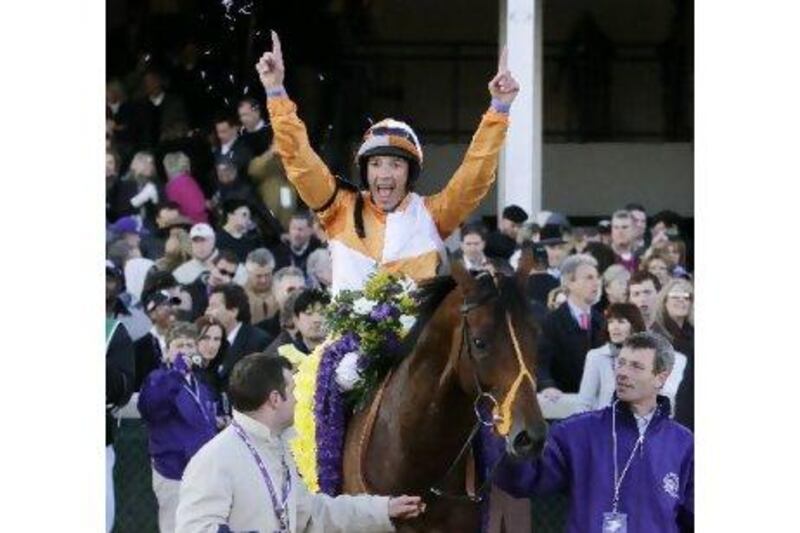 Frankie Dettori celebrates after riding Dangerous Midge to victory in the Breeders' Cup Turf.