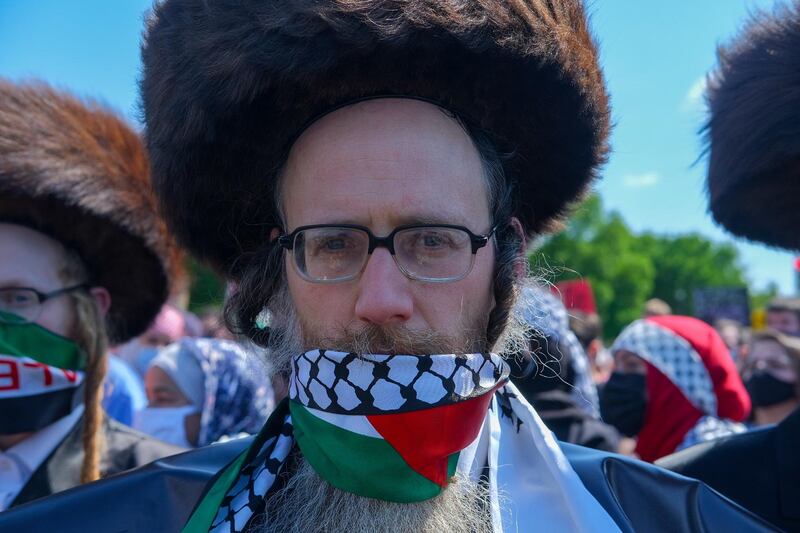 epa09203317 A member of Neturei Karta (Orthodox Jews United Against Zionism) poses as People attend a protest in support of Palestine in the 73rd anniversary of Nakba Day, in Washington, DC, USA, 15 May 2021. The protest was held in support of Palestinians during the ongoing violent confrontations with Israeli security forces that has left at least 140 people killed in Gaza and seven in Israel, according to local authorities. 'Nakba,' or 'catastrophe, which is marked on 15 May refers to the creation of the state of Israel in 1948 and the subsequent expulsion and displacement of Palestinians from their land. Palestinians keep old fashioned keys as a symbol of the homes they left behind and one day want to return to, many families still have the keys to their old homes from 1948.  EPA/GAMAL DIAB