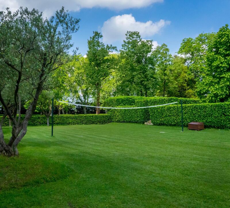 Lush green volleyball court. Courtesy Chateau De Tourreau