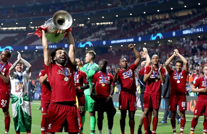 Liverpool's Mohamed Salah celebrates with the trophy after the UEFA Champions League Final at the Wanda Metropolitano, Madrid. PRESS ASSOCIATION Photo. Picture date: Saturday June 1, 2019. See PA story SOCCER Final. Photo credit should read: Martin Rickett/PA Wire. RESTRICTIONS: Editorial use only in permitted publications not devoted to any team, player or match. No commercial use. Stills use only - no video simulation. No commercial association without UEFA permission. please contact PA Images for further information.