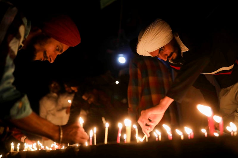 Farmers light candles to mark the 552nd birth anniversary of Guru Nanak Dev at a protest site near the Delhi-Haryana border earlier this week. Reuters