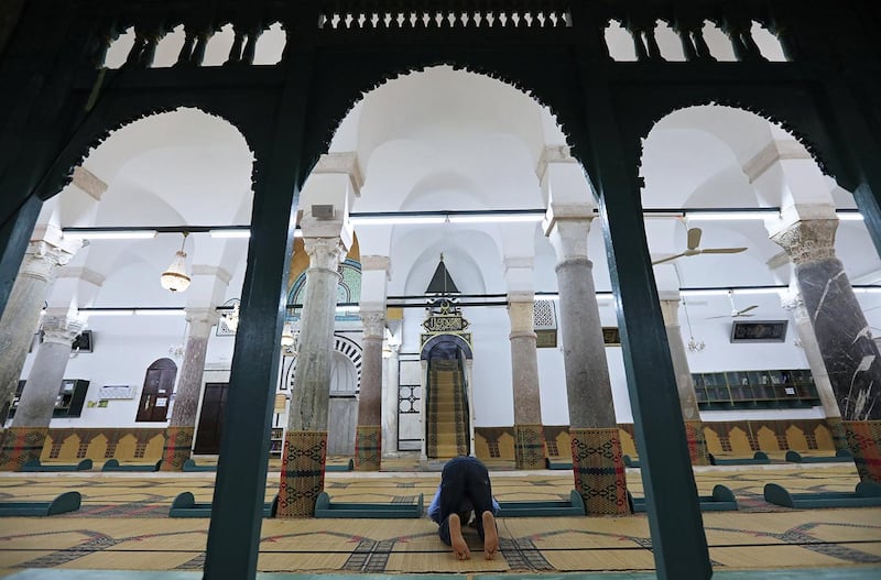 A man prays at a mosque on the first day of Ramadan in Tunis, Tunisia, May 17, 2018. REUTERS/Zoubeir Souissi