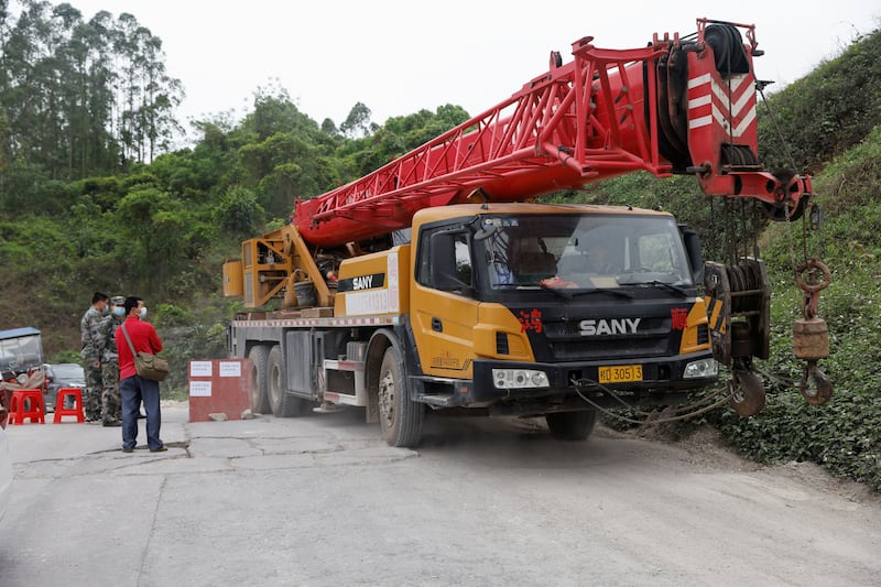 A crane arrives at Lu village to aid search and rescue workers. Reuters