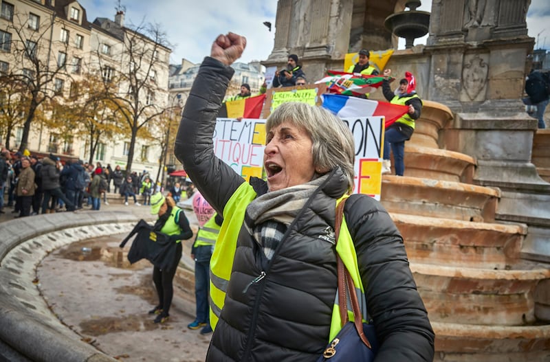 Yellow vest protesters chant against President Macron at the Fontaine des Innocents in Paris during the second day of protests to mark the first anniversary of the movement, in November 2019.
