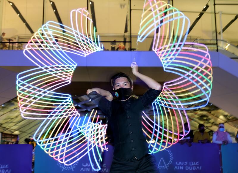 A performer entertains the crowd at the opening