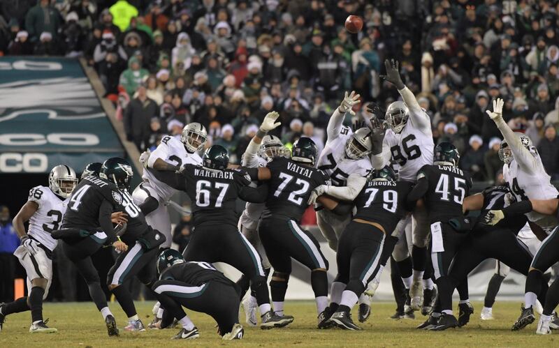 Dec 25, 2017; Philadelphia, PA, USA; Philadelphia Eagles kicker Jake Elliott (4) kicks a 48-yard field goal out of the hold of punter Donnie Jones (8) with 27 seconds left against the Oakland Raiders  during an NFL football game at Lincoln Financial Field. The Eagles defeated the Raiders 19-10. Mandatory Credit: Kirby Lee-USA TODAY Sports