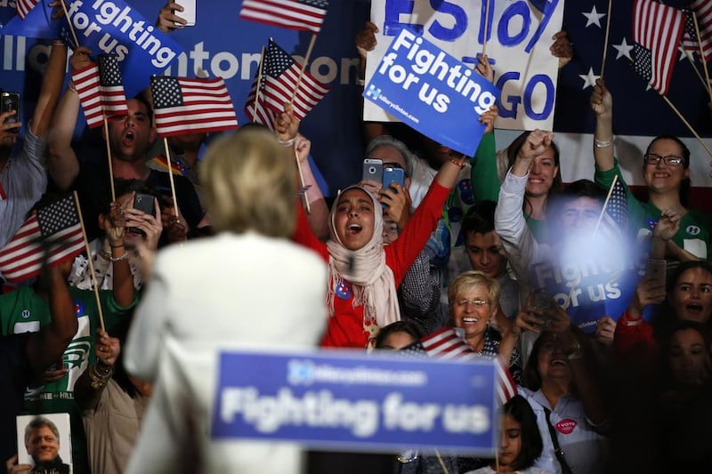 Democratic presidential candidate Hillary Clinton waves to Muslim supporters during a campaign rally in March 2016. Rhona Wise / AFP