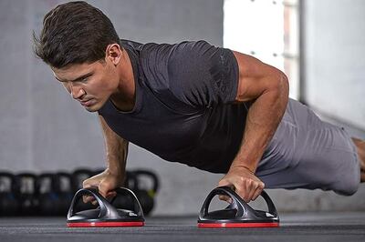 Rotating push-up bars take the pressure off the wrists to help with form. Photo: Adidas