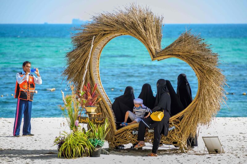 Tourists on the beach in Thailand.