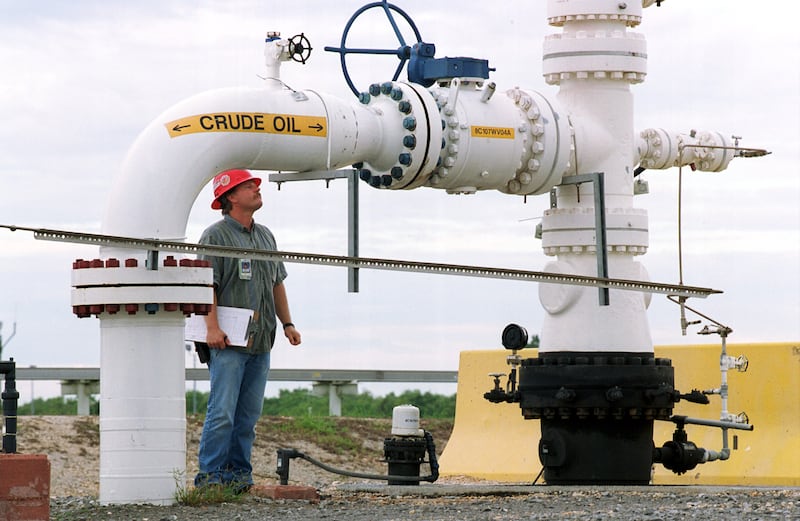 A field operator inspects oil well-heads near Beaumont, Texas. Field operators in the UAE with experience of two to five years are paid between Dh5,000 to Dh7,000 a month. Photo: Newsmakers