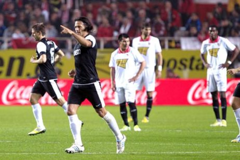 Malaga defender Martin Demichelis celebrates his goal against Sevilla.