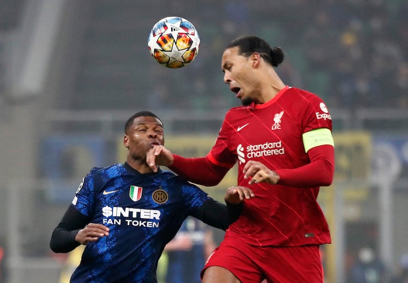 Inter's Denzel Dumfries challenges Liverpool's Virgil van Dijk. Reuters