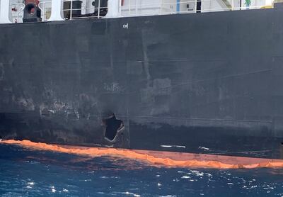 A picture taken during a guided tour by the US Navy (NAVCENT) shows the damage in the hull of the Japanese oil tanker Kokuka Courageous off the port of the Gulf emirate of Fujairah on June 19, 2019. - The Japanese tanker attacked in the Gulf of Oman last week was damaged by a limpet mine resembling Iranian mines, the US military in the Middle East said today. Commander Sean Kido of the US Navy told reporters that the US military has recovered biometric information of the assailants on the Japanese ship including "hand and finger prints." Two oil tankers were damaged in twin attacks close to the Iranian coast on June 13, just outside the strategic Strait of Hormuz. (Photo by Mumen KHATIB / AFP)