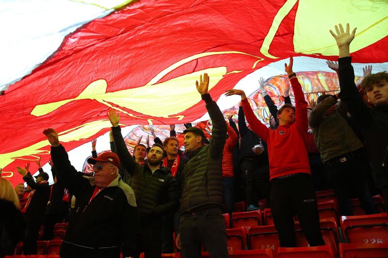 Fans stand underneath a TIFO display prior to the match. Getty Images