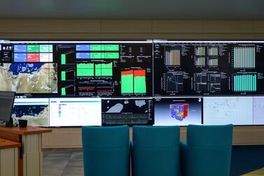 Screens flash with data at Adnoc's Thamama subsurface centre, which has become critical to optimise production efficiency and save costs. Khushnum Bhandari/ The National