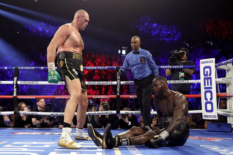 LAS VEGAS, NEVADA - FEBRUARY 22: Tyson Fury knocks down Deontay Wilder in the fifth during their Heavyweight bout for Wilder's WBC and Fury's lineal heavyweight title on February 22, 2020 at MGM Grand Garden Arena in Las Vegas, Nevada.   Al Bello/Getty Images/AFP
== FOR NEWSPAPERS, INTERNET, TELCOS & TELEVISION USE ONLY ==
