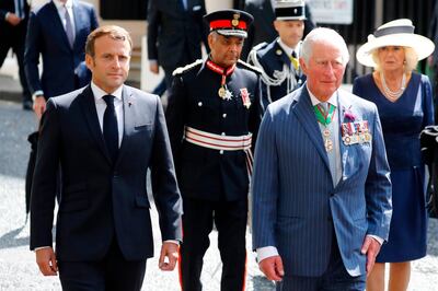 French President Emmanuel Macron (L), The Lord-Lieutenant of Greater London, Sir Kenneth Olisa (2nd L), Britain's Prince Charles, Prince of Wales (2nd R) and Britain's Camilla, Duchess of Cornwall (R) arrive to lay wreaths at the statue of former French president Charles de Gaulle at Carlton Gardens in central London on June 18, 2020 during a visit to mark the anniversary of former de Gaulle's appeal to French people to resist the Nazi occupation.  Macron visited London on June 18 to commemorate the 80th anniversary of former French president Charles de Gaulle's appeal to French people to resist the Nazi occupation during World War II. / AFP / POOL / Tolga AKMEN
