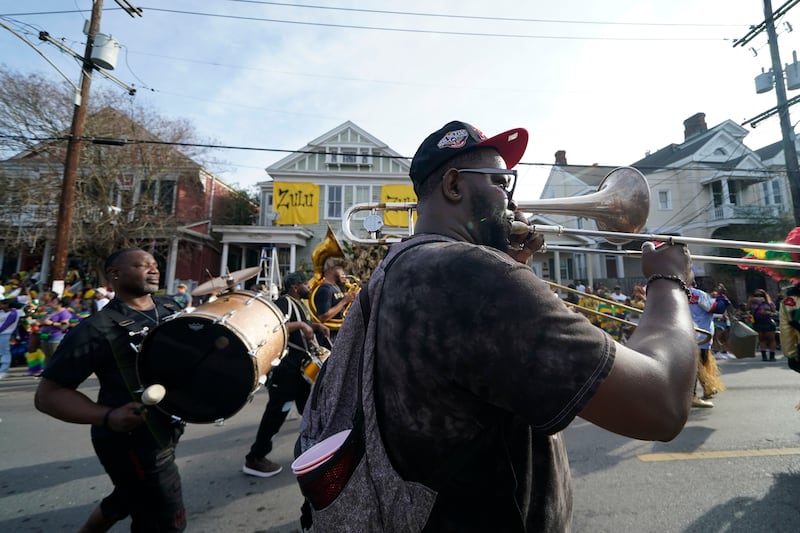 A brass band marches during the traditional Krewe of Zulu Parade. AP