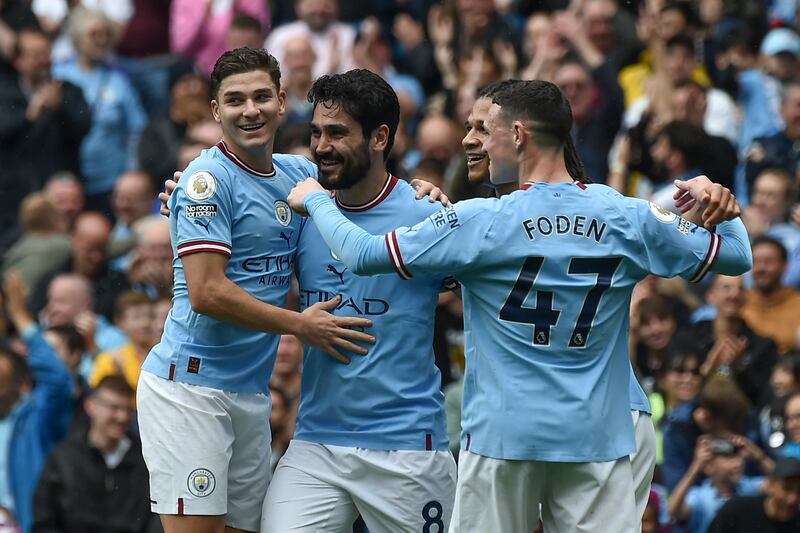 Manchester City's Ilkay Gundogan, second from left, celebrates with teammates after scoring his side's 2nd goal during the English Premier League soccer match between Manchester City and Leeds United at Etihad stadium in Manchester, England, Saturday, May 6, 2023.  (AP Photo / Rui Vieira)