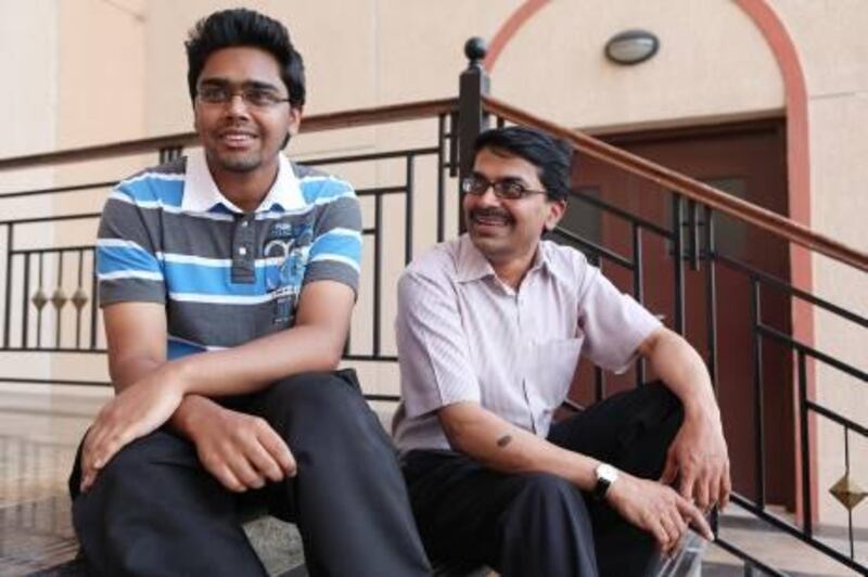 May 23, Akhilesh Mohan, the top CBSE student, shares a moment with his Farther, Mohan Sankaran, after writing a 3hour exam at BITS Pilani in Dubai Academic City on May 22, 2011 Dubai, United Arab Emirates (Photo: Antonie Robertson/The National)