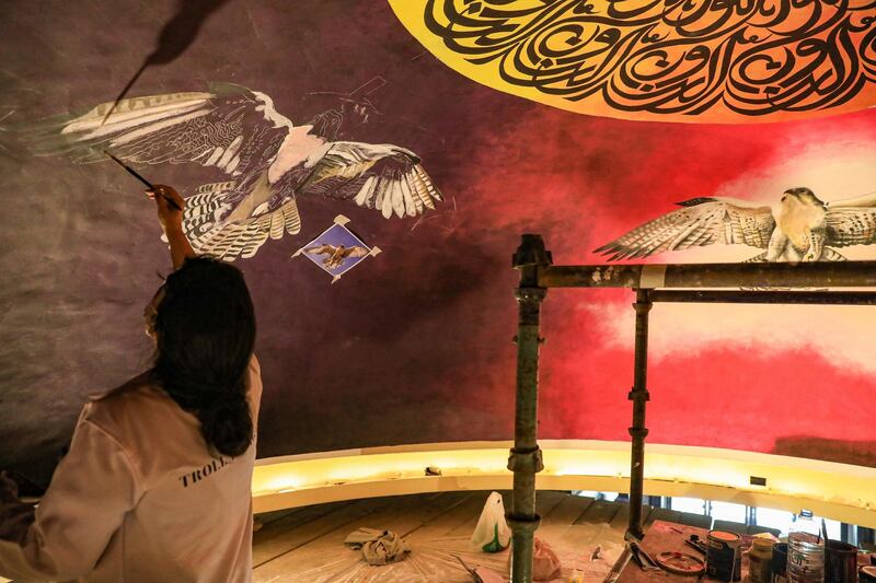 Amalie Beljafla working on her surreal mural 'Al Noor'. All images courtesy of the artists and Souk Madinat Jumeirah