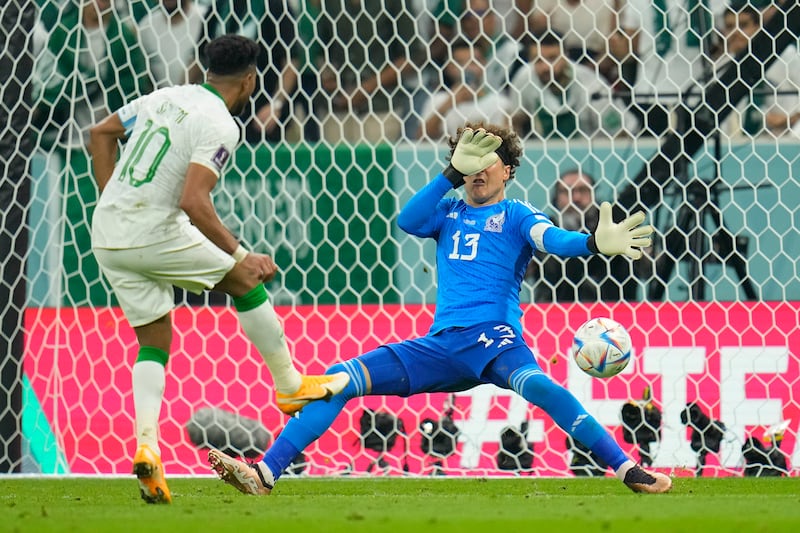 Saudi Arabia's Salem Al Dawsari fires the ball past Mexico goalkeeper Guillermo Ochoa in their World Cup Group C 2-1 defeat to the Central American team at Lusail Stadium, Qatar, on Wednesday, Novemeber 30, 2022. AP