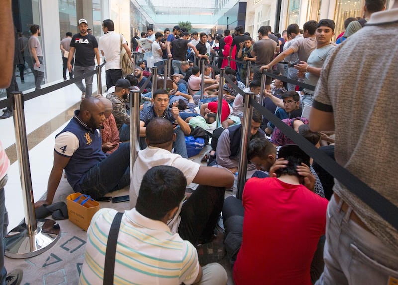 DUBAI, UNITED ARAB EMIRATES, 21 SEPTEMBER 2018 - Crowd at Iphone XS launch at Apple store Dubai Mall.  Leslie Pableo for The National