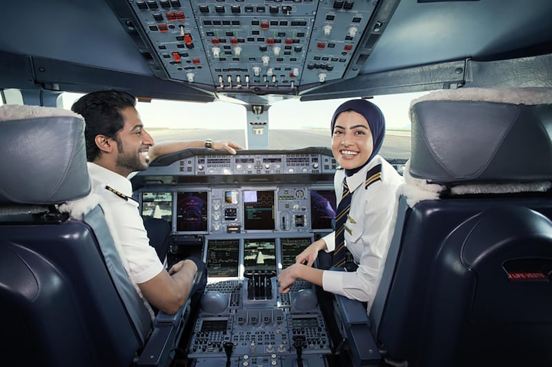 One of Emirate Airline's youngest pilots, Bakhita Al Muhairi, 23, an Emirati, is pictured in the cockpit alongside a colleague.