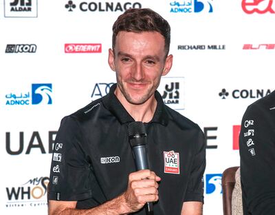 Adam Yates speaks on stage during an event in Abu Dhabi for UAE Team Emirates. Victor Besa / The National