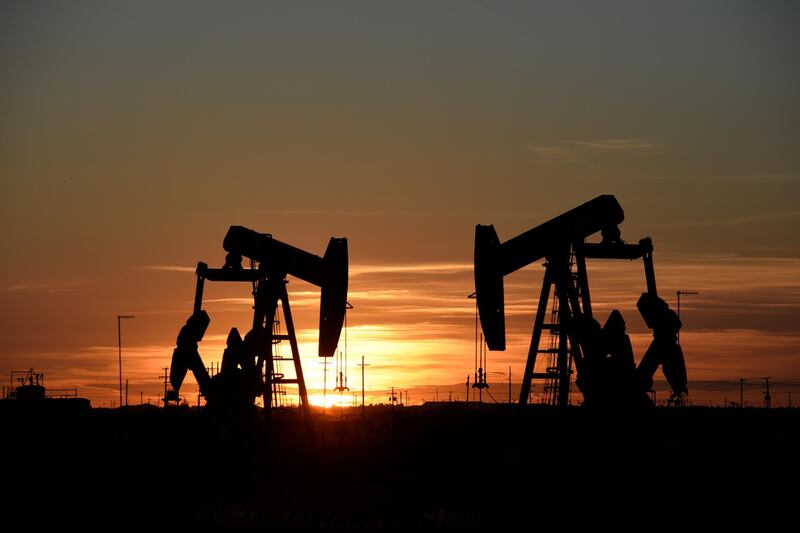 FILE PHOTO: Pump jacks operate at sunset in an oil field in Midland, Texas U.S. August 22, 2018. Picture taken August 22, 2018. REUTERS/Nick Oxford/File Photo