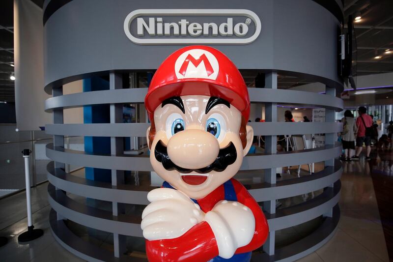 epa08979897 (FILE) - A statue of Nintendo Co.'s video game character Super Mario stands at the company's showroom in Tokyo, Japan, 27 July 2016 (reissued 01 January 2021) Nintendo was to release their 9 months results on 01 January 2021.  EPA/KIYOSHI OTA *** Local Caption *** 52913239